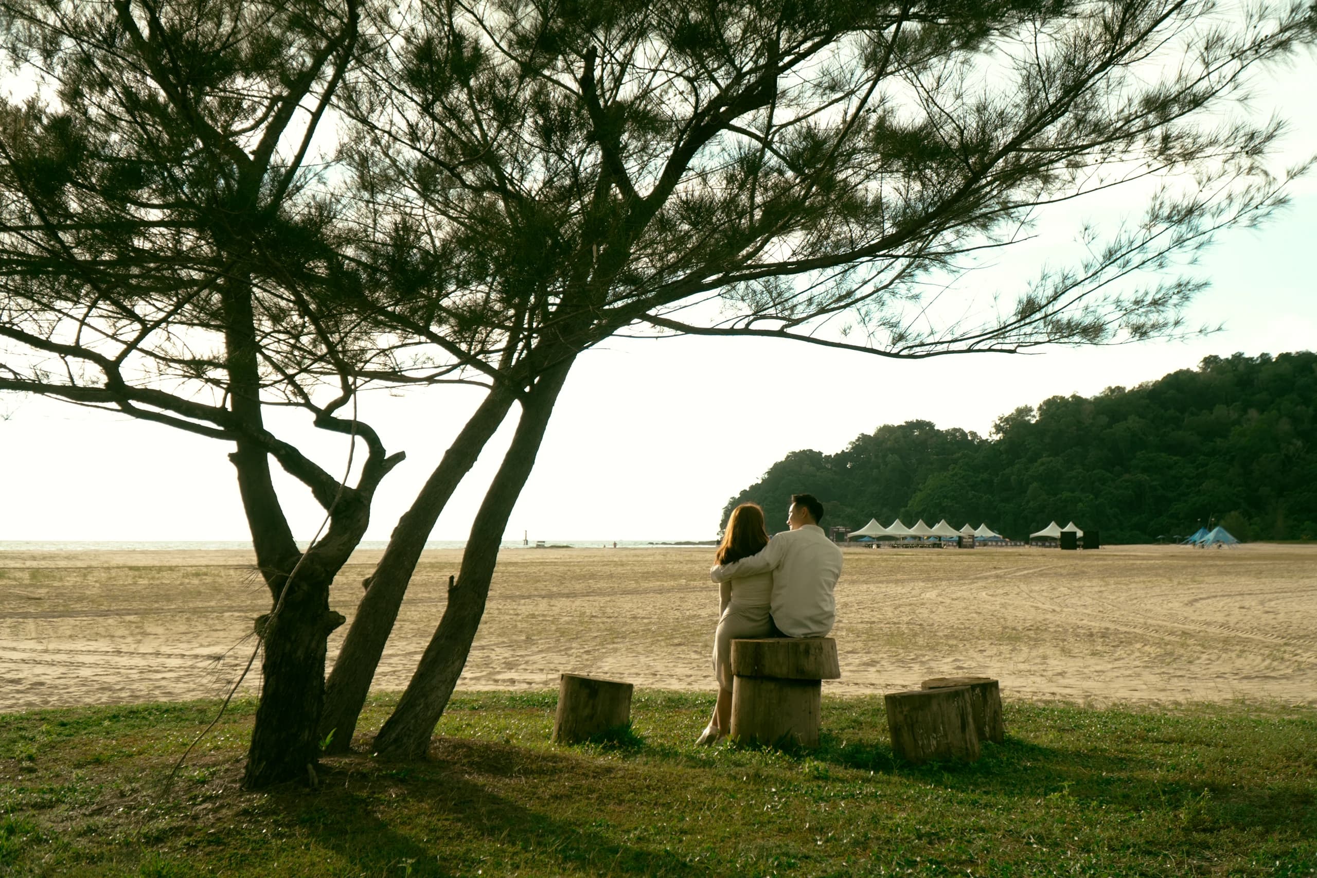 Ian and Phy sitting together by the Rasa Ria beach
