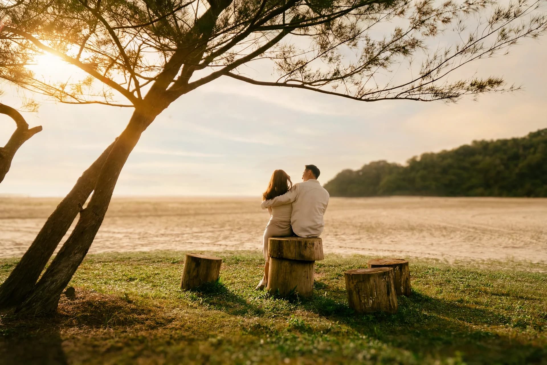 Ian and Phy sitting together beneath a tree at Rasa Ria